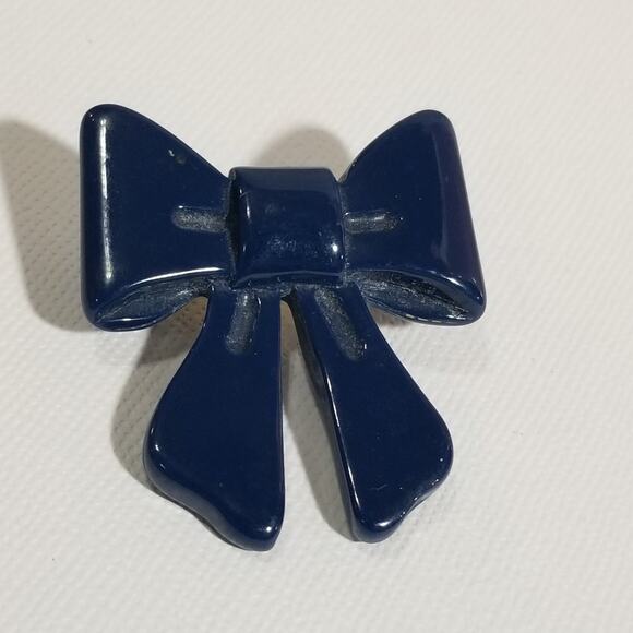 Vintage blue bow brooch (looks green under black light) - Picture 1 of 11